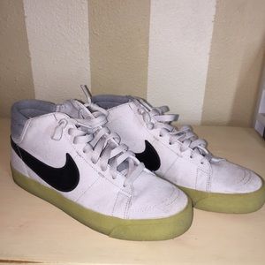 Women’s Nike light grey canvas high top sneaker.